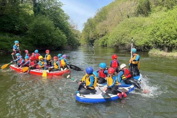 paddle boarding group on moster board
